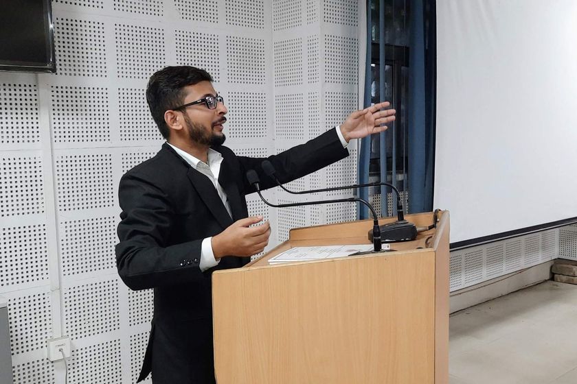 Shivanshu K. Srivastava speaking at a lectern